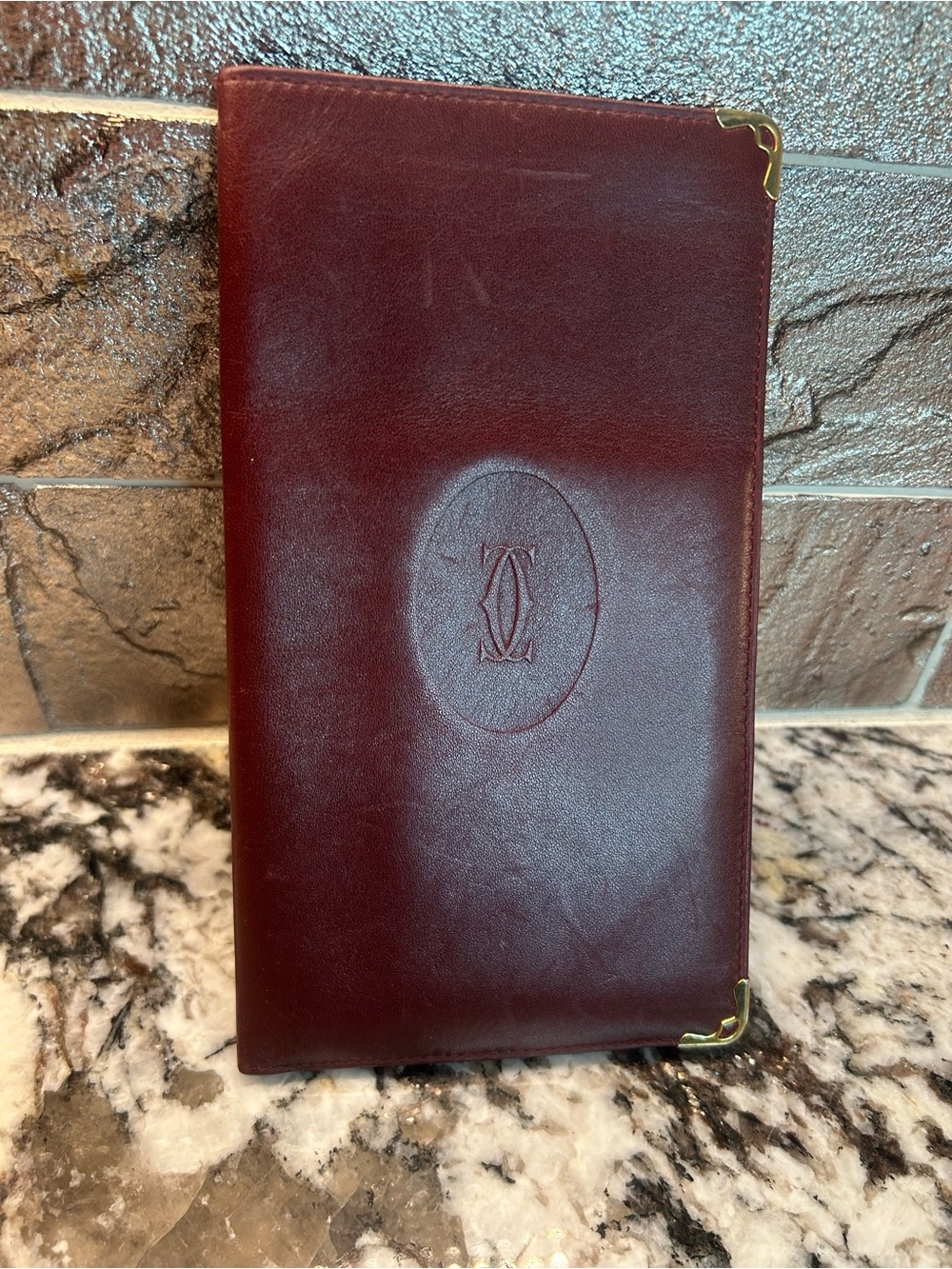Cartier Burgundy Leather Money Clip with Gold Corner Accents